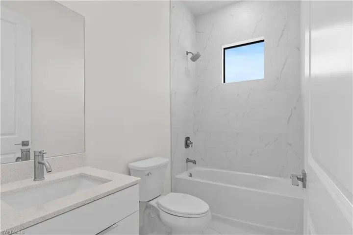Full bathroom with bathing tub / shower combination and vanity
