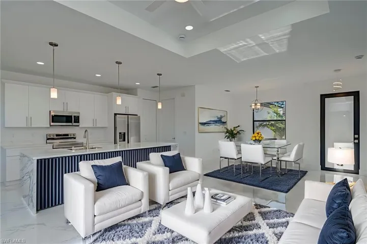 Living room featuring recessed lighting and ceiling fan
