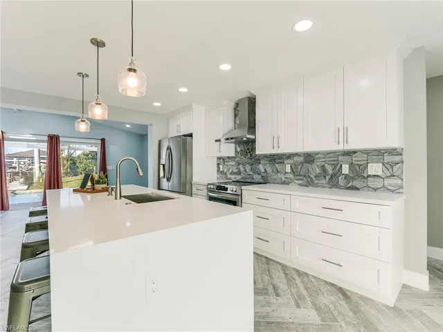 Waterfall island with perfect kitchen layout and room for 4 barstools