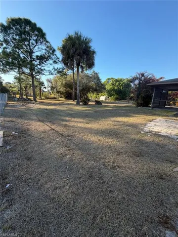 View of yard with a sunroom