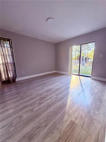 Spare room with light wood finished floors and baseboards