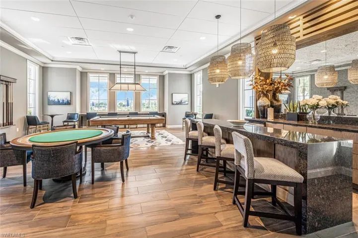 Playroom featuring billiards, ornamental molding, and wood-type flooring