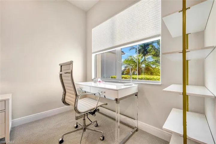 Home office featuring light colored carpet