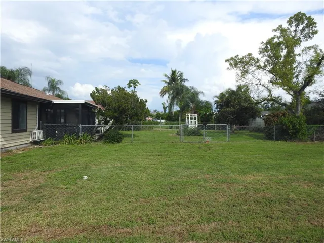 View of yard with a sunroom