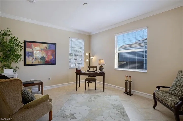Tiled office featuring crown molding and plenty of natural light