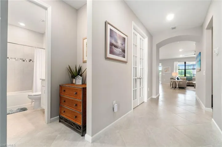 Hall featuring drop zone by front door, can be converted to a closet