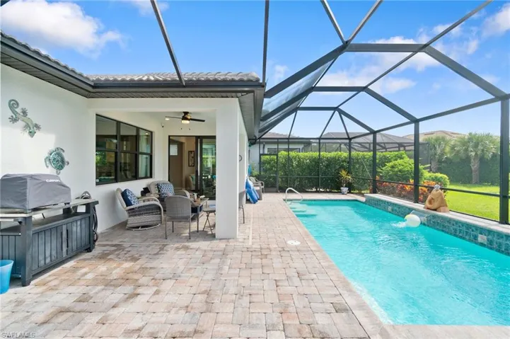 large gas heated salt swimming pool with water feature