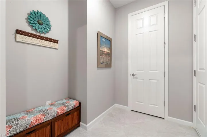 Entry area from garage with large closet, and drop zone