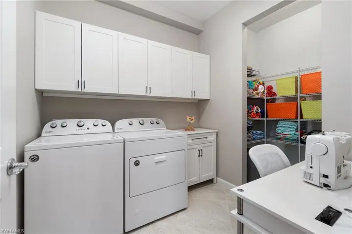 Laundry room with storage cabinetry