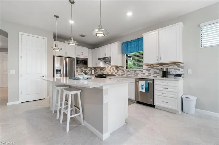 Kitchen featuring a large pantry and plenty of cabinets with pull out drawers for efficient and convenient storage