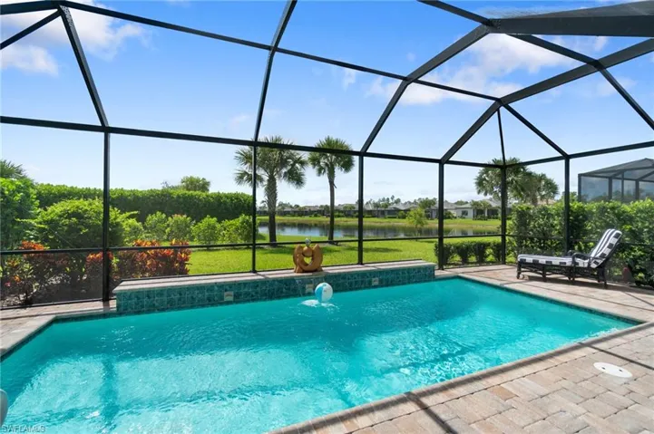 Pool home with Lake view and screen lanai
