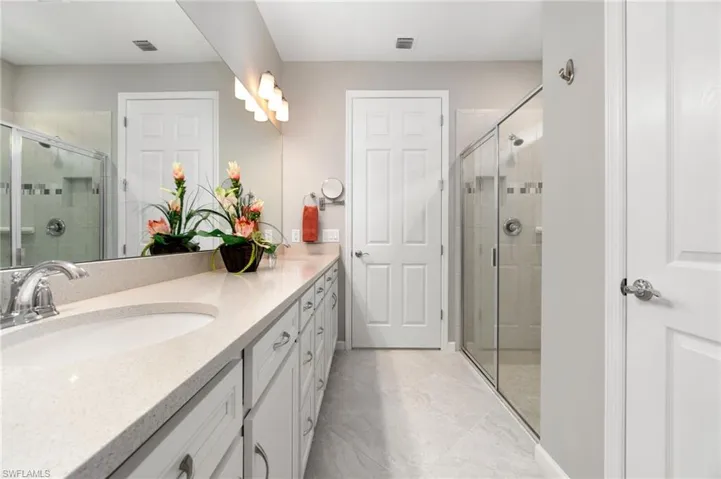 Bathroom with vanity and walk in shower