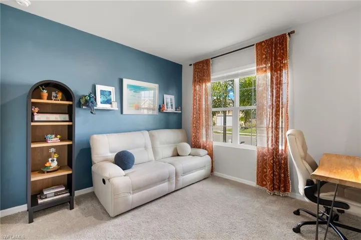 Office space with baseboards and carpet floors