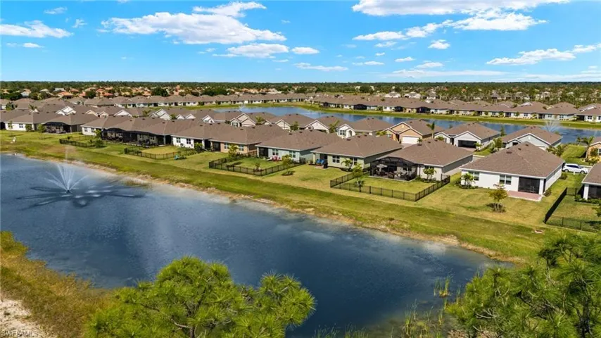 Drone / aerial view with a water view and a residential view