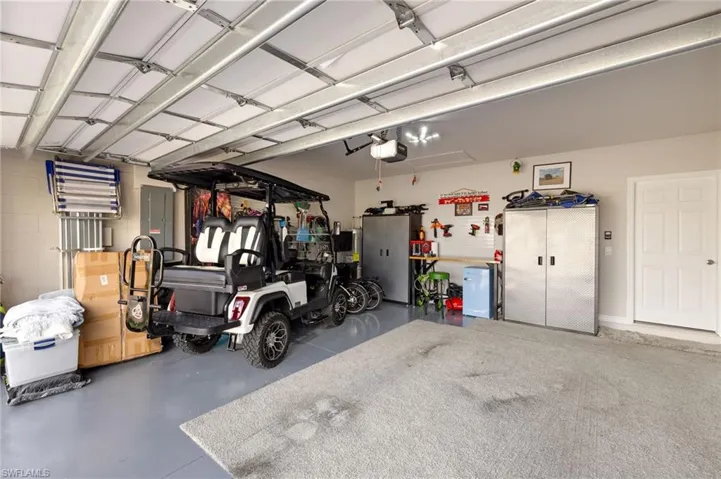 Garage featuring a garage door opener