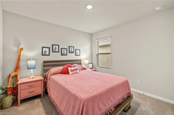 Bedroom with carpet flooring and baseboards