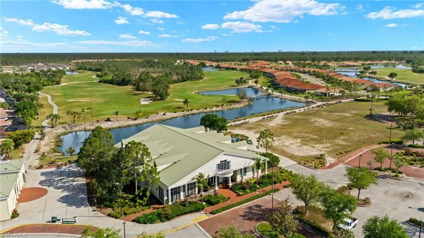 Bird's eye view featuring view of golf course, club house, and restaurant.