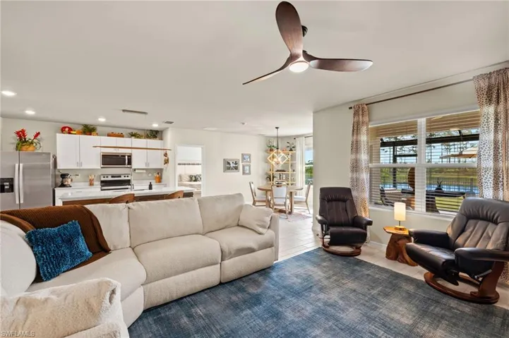 Living room featuring recessed lighting and ceiling fan