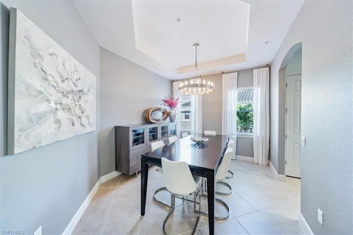 Large Dining area with custom light fixture.
