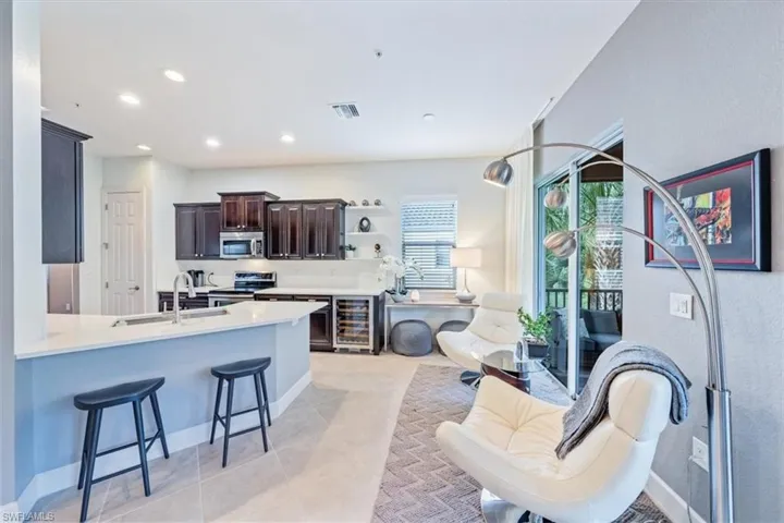 Kitchen extension including wine refrigerator.