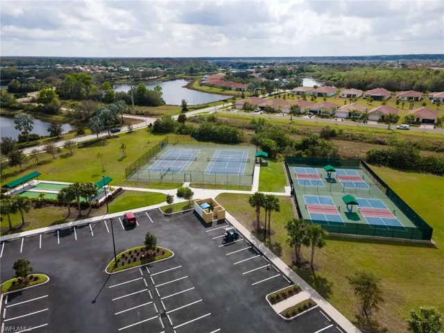 Aerial perspective of suburban area featuring a large body of water