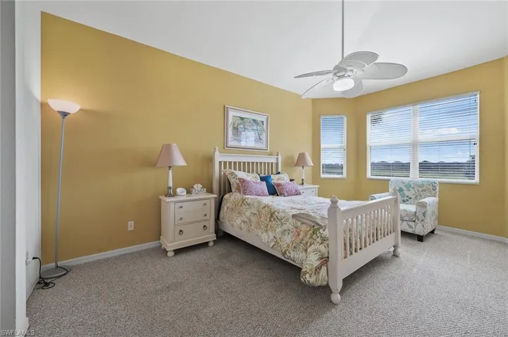 Bedroom featuring carpet flooring and ceiling fan