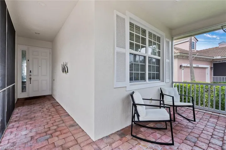 Entrance to property featuring stucco siding