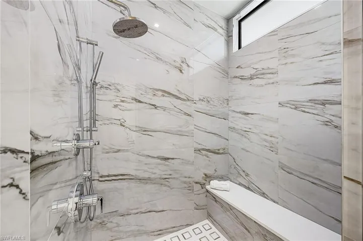 Bathroom with a marble finish shower - Virtually Edited Image