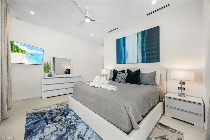 Bedroom featuring ceiling fan and baseboards - Virtually Edited Image