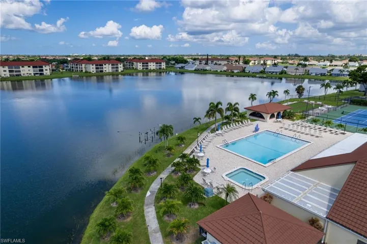 Aerial view of a pool and a large body of water