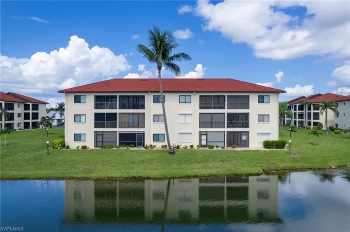View of apartment building / complex with a water view