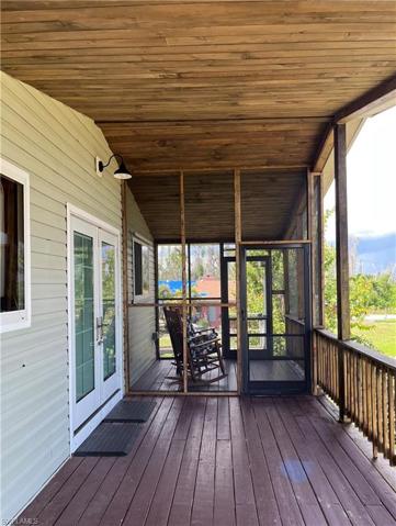 Half screened, half open front porch.