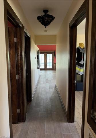 Hallway to living room and kitchen.