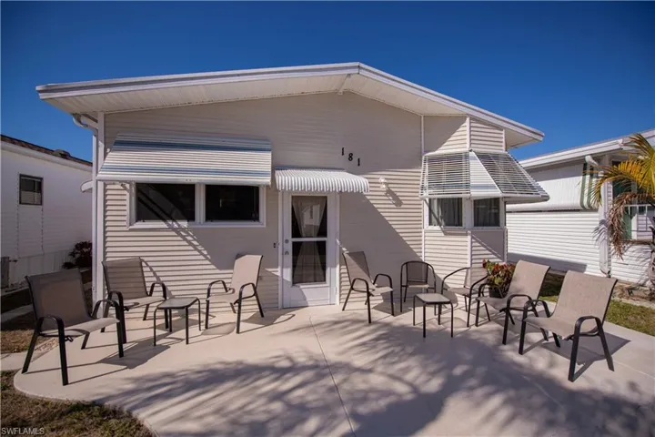 Front view of house with a patio area and a residential view