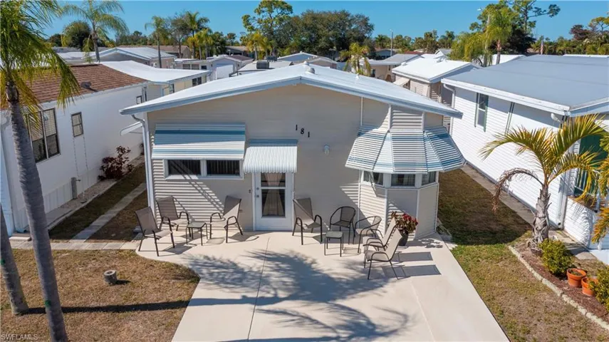 Front view of house with a patio area and a residential view