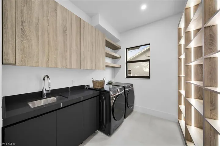 Laundry room with washer and dryer and cabinet space