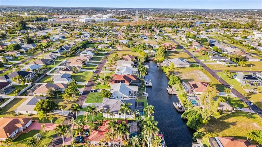 Aerial perspective of suburban area with a large body of water