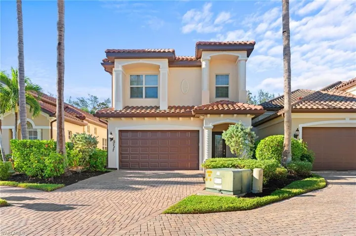 Mediterranean / spanish house with a garage