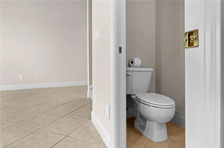 Bathroom with tile patterned floors and toilet