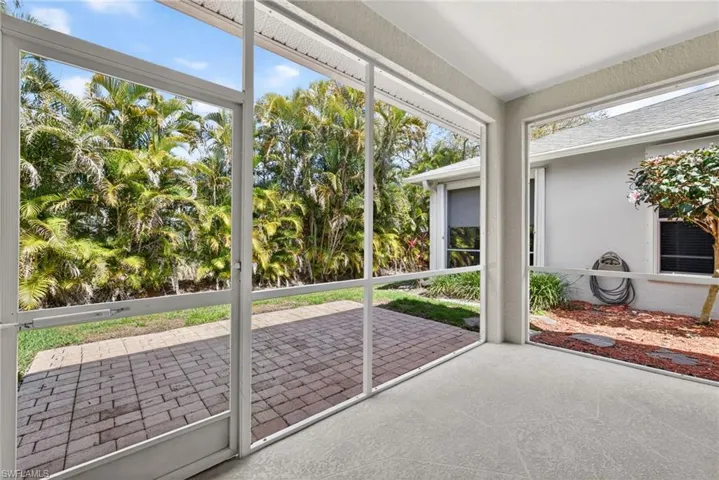 Unfurnished sunroom featuring plenty of natural light