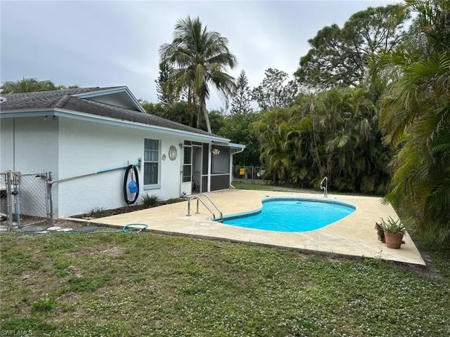 View of pool featuring a yard and a patio