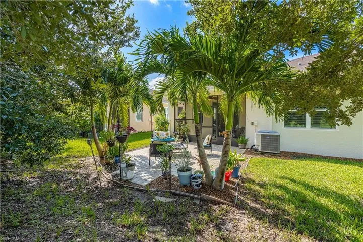 View of yard featuring central AC unit and a patio