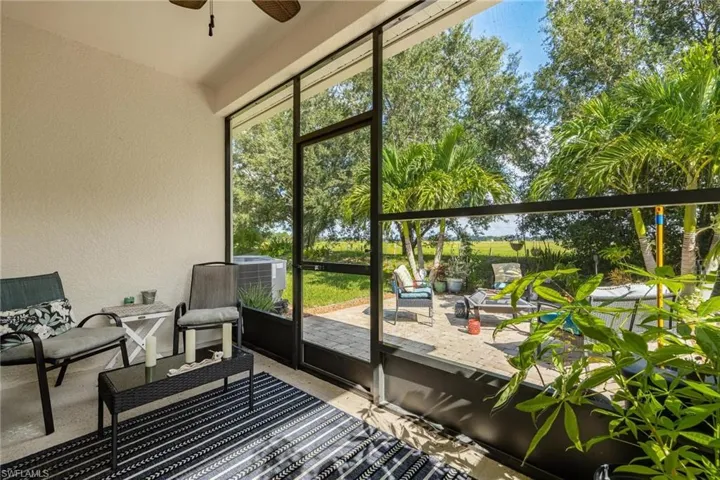 Sunroom / solarium featuring ceiling fan