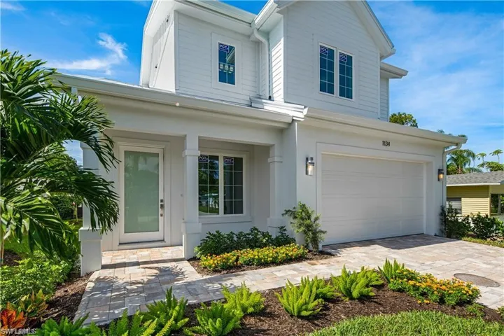 View of front of home featuring driveway and an attached garage