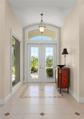 Custom tile floor greets you and flows to formal living & dining area
