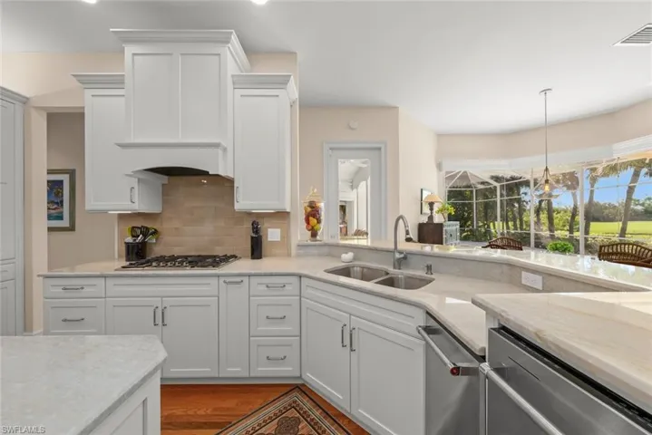 Large chef's kitchen with gas stove, island & custom cabinetry & finishes