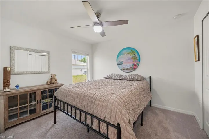 Bedroom with carpet flooring and ceiling fan