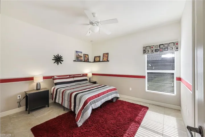 Tiled bedroom with ceiling fan