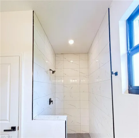 Full bathroom featuring a stall shower and recessed lighting