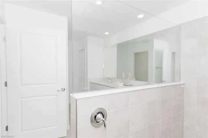 Full bath with double vanity and recessed lighting